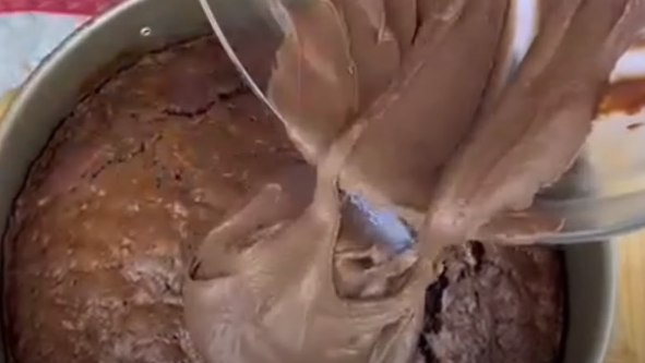topping the zucchini chocolate cake with the ganache