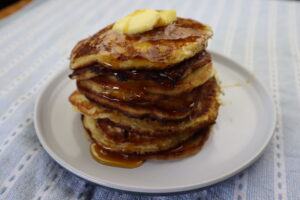 sourdough buttermilk pancakes drizzled with syrup