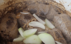 add sliced onion to the dish