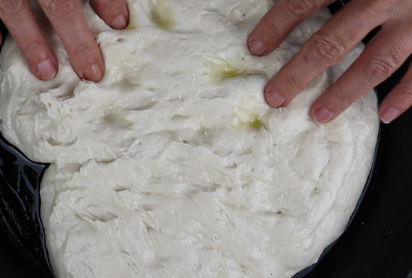 pizza dough in the cast iron pan